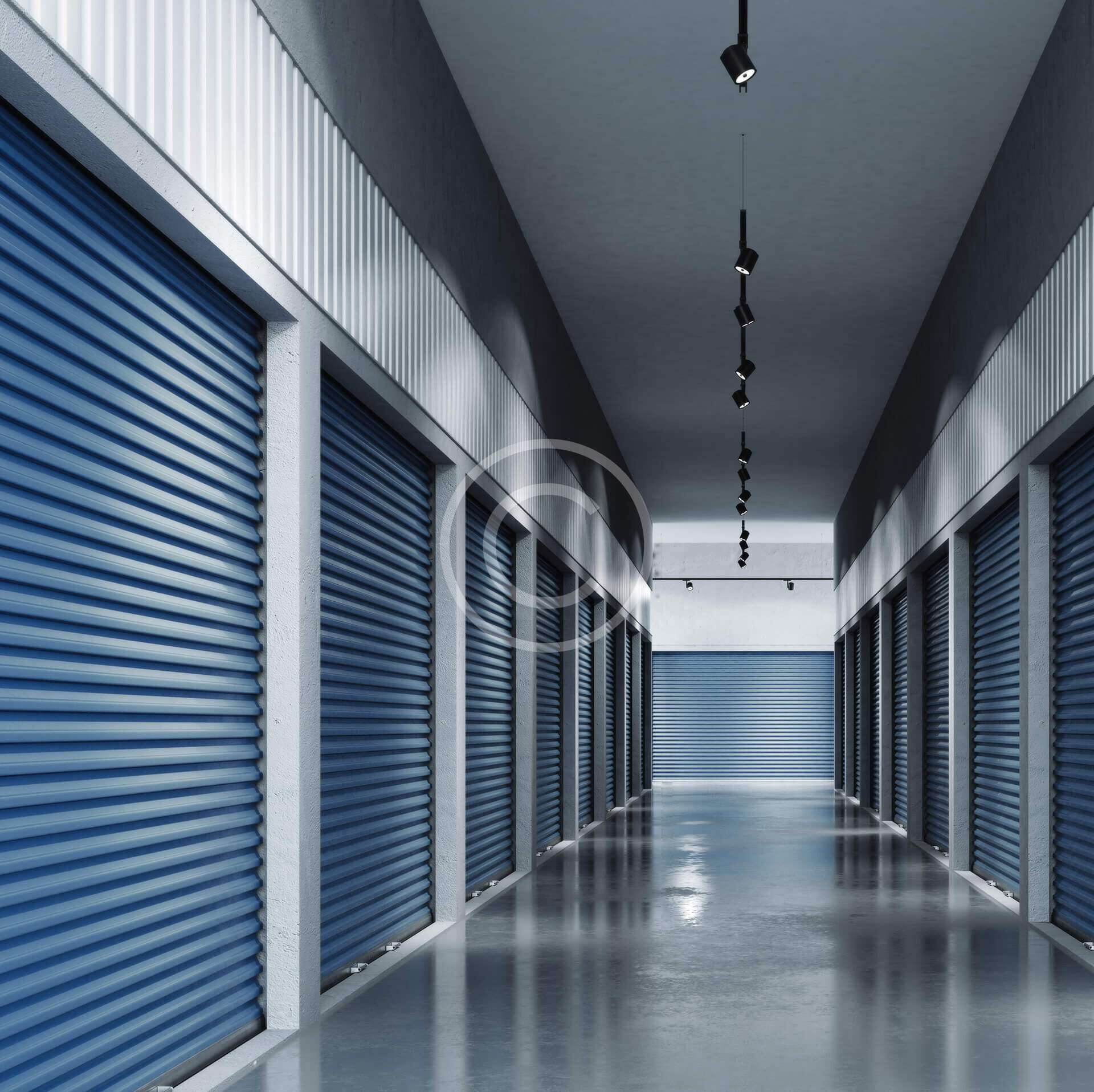 A clean corridor with closed blue storage unit doors.