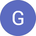 A simple blue circle with a white letter 'G' centered inside.